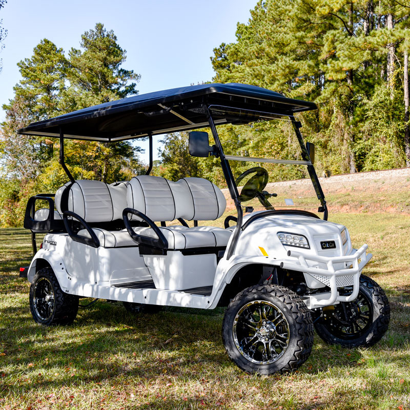 white golf cart in grass